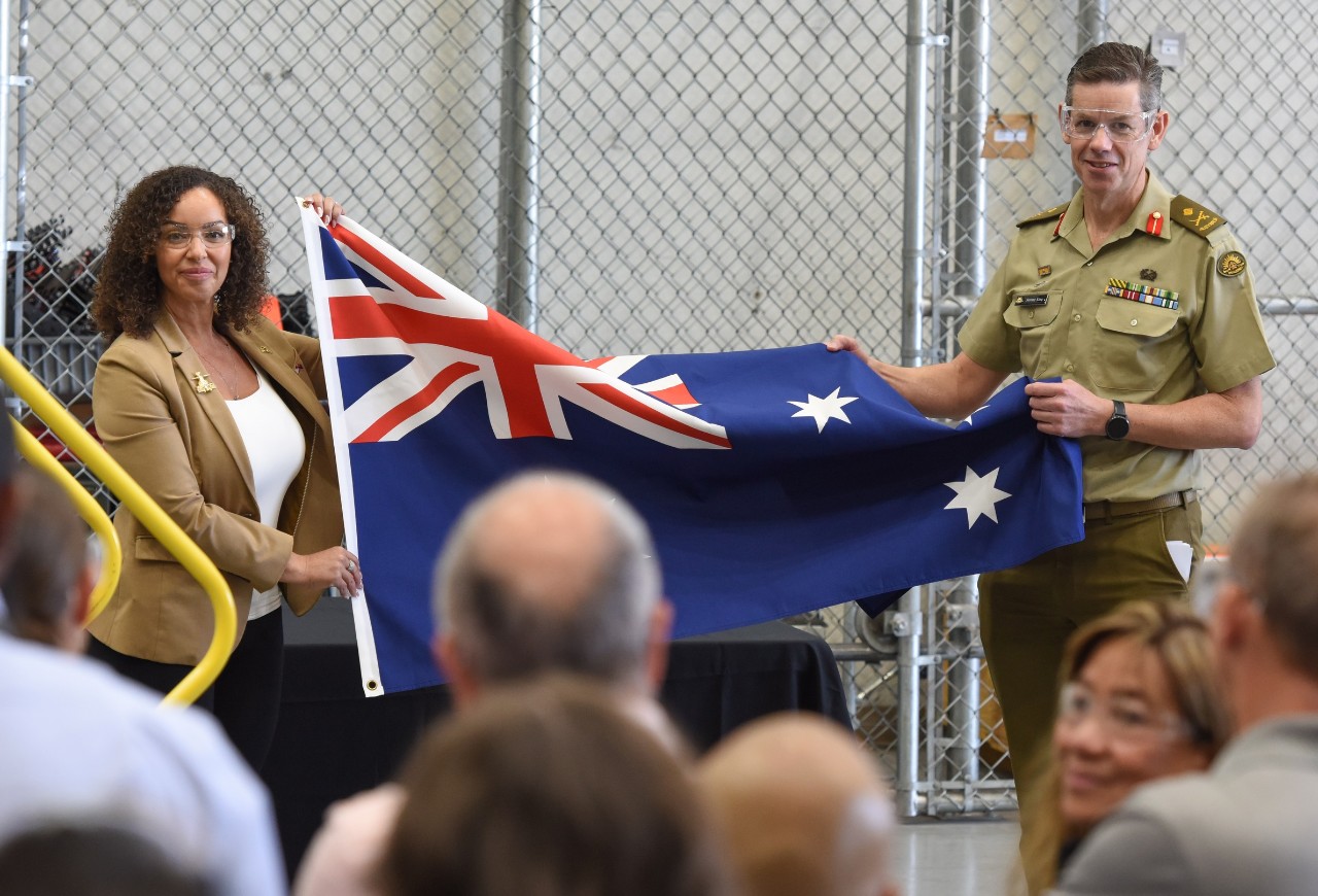 Christina Upah, vice president of Boeing Attack Helicopter Programs and Major General Jeremy King, Head of the Australian Defence Department’s Joint Aviation Systems Division with the Australian flag at Mesa.