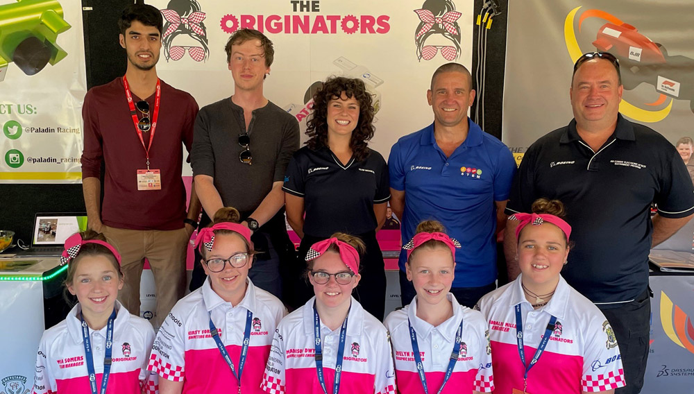 The Originators team (front row left to right) Mia, Kirsty, Maddison, Evelyn and Maddalin with Boeing supporters (back row left to right) Zaid, Kincaid, Anita, Simon and Jim.